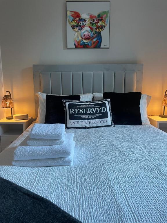 a bedroom with a bed with two pillows on it at The Nairn Neuk - Couples Cosy Getaway in Nairn