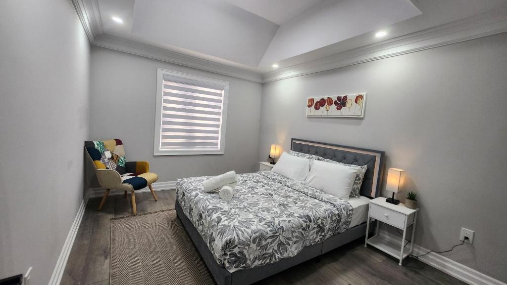 Ένα ή περισσότερα κρεβάτια σε δωμάτιο στο Toronto Guest House