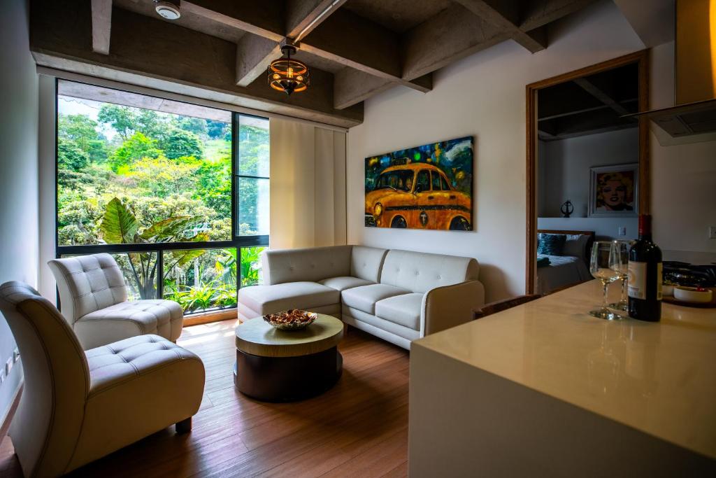 a living room with a couch and a table at Home away from home - By Adri in Envigado
