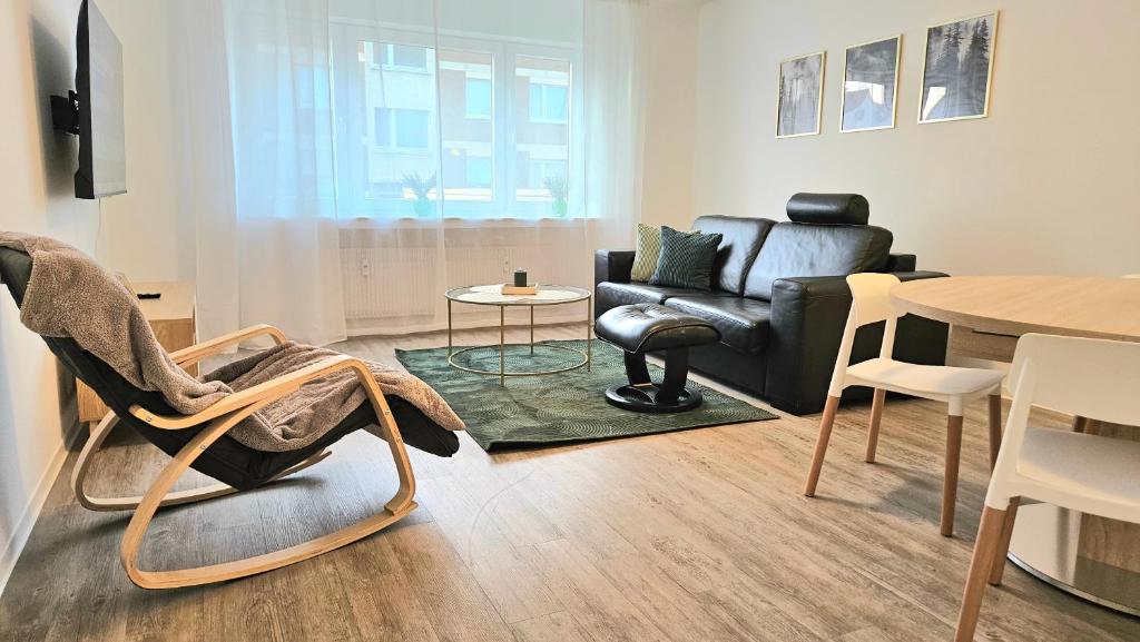 Un lugar para sentarse en 3 Zimmer I Küche I Balkon I WLAN I Parken I Seepark