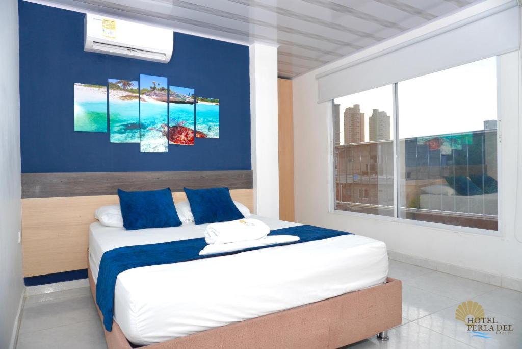 Postel nebo postele na pokoji v ubytování Hotel Perla del Caribe
