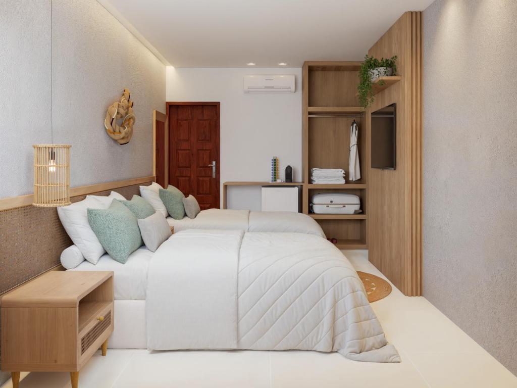 Ένα ή περισσότερα κρεβάτια σε δωμάτιο στο Villa Sol e Mar