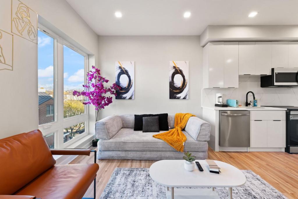 a living room with a couch and a table at Citizen Apartment Washington DC in Washington, D.C.