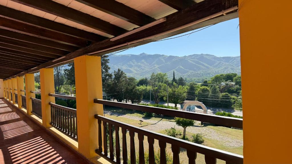 a balcony with a view of the mountains at Hotel ALTOS DE ARUNA in Bialet Massé