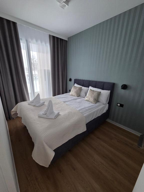 Ένα ή περισσότερα κρεβάτια σε δωμάτιο στο Omega Lake Family 2