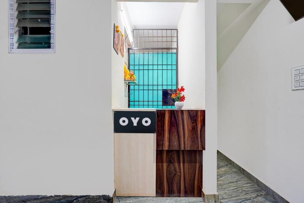 a sign that reads oxo in front of a building at Hotel O Bhuvika Residency in Jālahalli