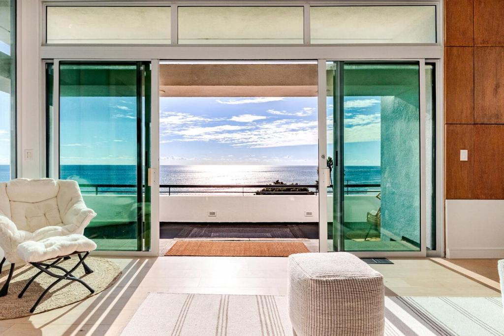 a living room with a view of the ocean at Gorgeous Malibu Retreat with #Instaworthy Ocean Views in Malibu Beach
