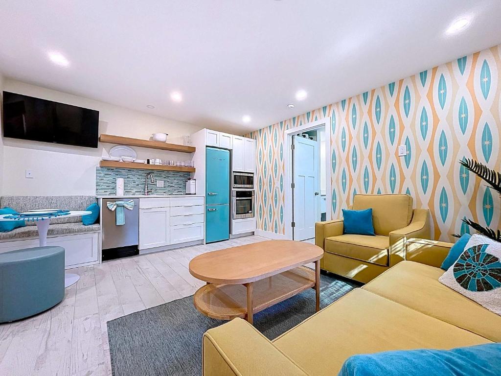 a living room with a couch and a table at Reel Paradise steps to bay beach fishing dock in Bradenton Beach