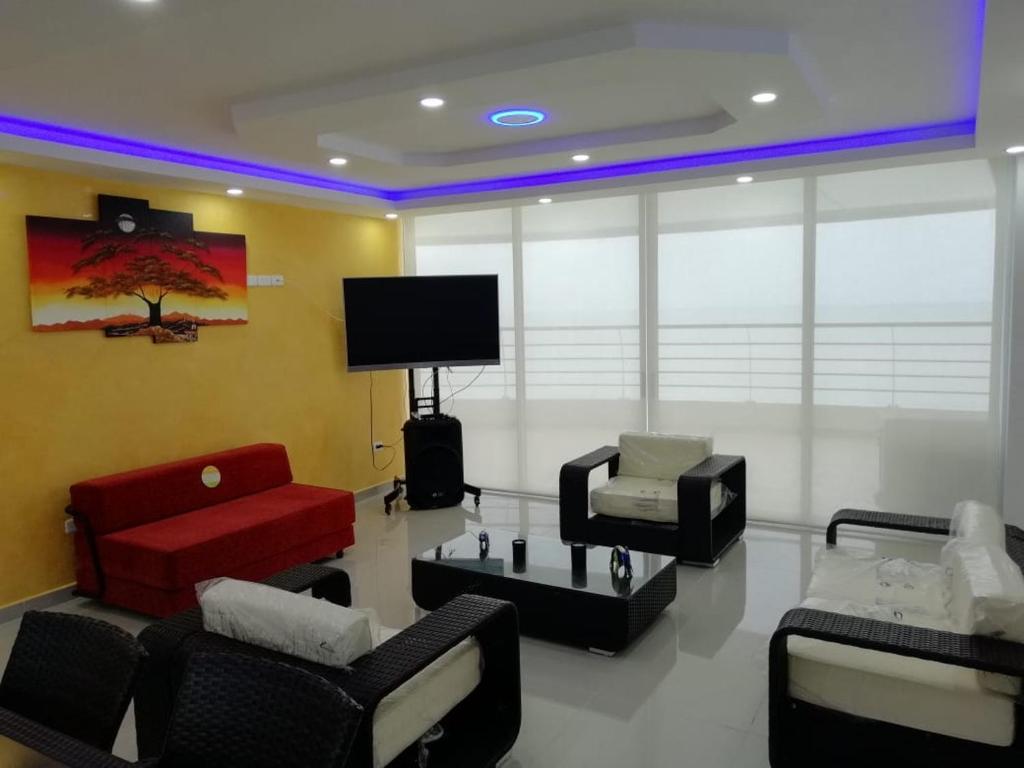 TV a/nebo společenská místnost v ubytování Departamento Tonsupa Fontainebleau