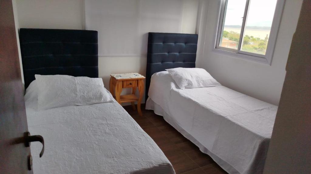 Giường trong phòng chung tại Edificio Rey Niño