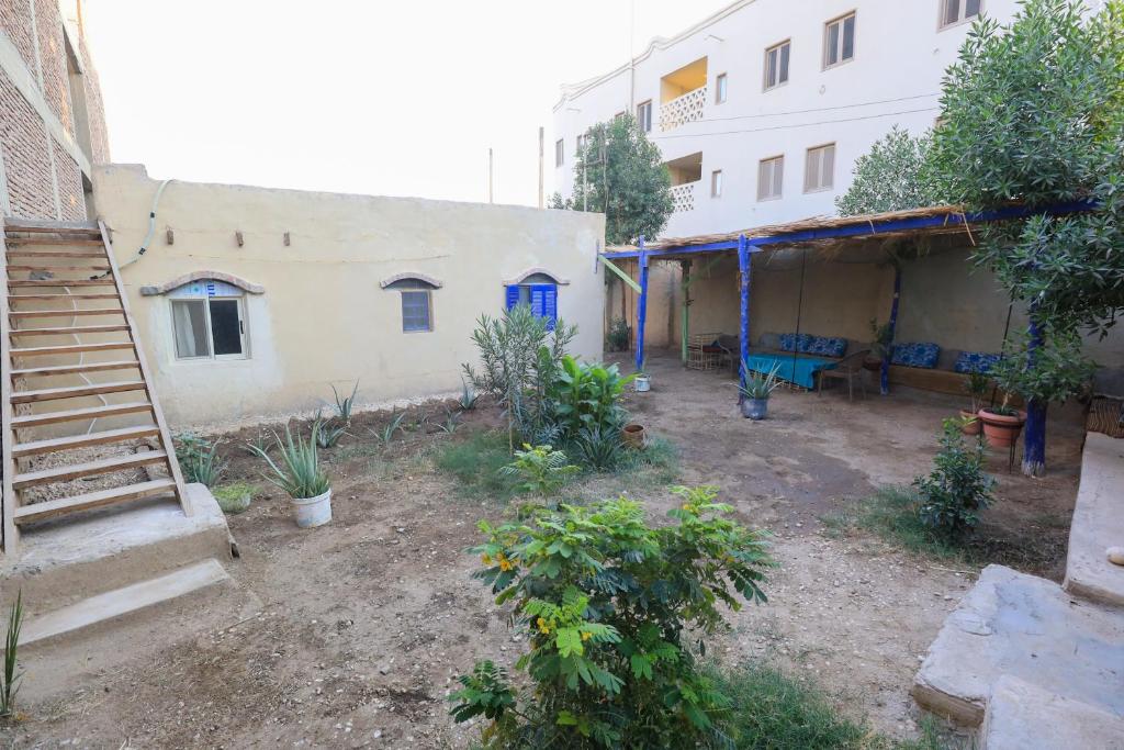 an empty yard next to a building with a house at Deja house in Luxor