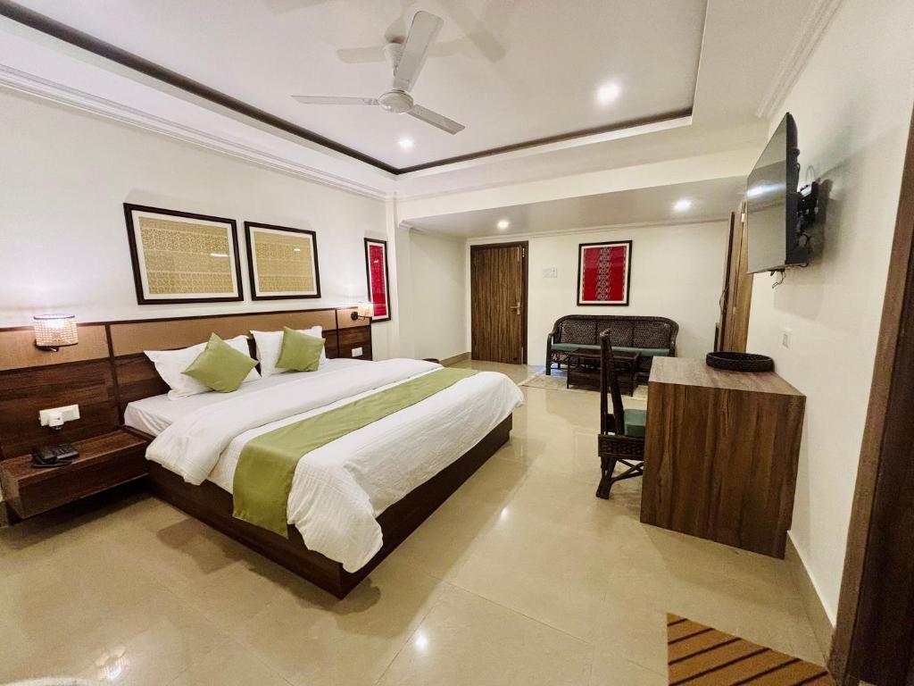 Ένα ή περισσότερα κρεβάτια σε δωμάτιο στο The Harmony Heritage Near Paltan Bazar