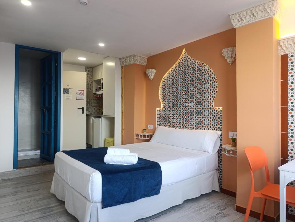 Кровать или кровати в номере Al-Andalus hause a 9min. del centro en metro