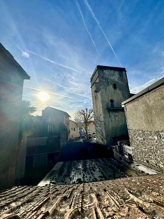 a view of a street with the sun in the sky at A l'ombre de la Tour in Lourdes