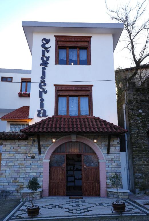 a building with a large door in front of it at Hotel Boutique Ergjeria in Gjirokastër