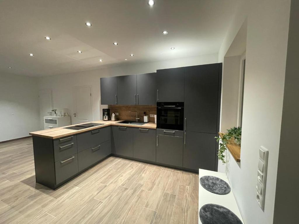 Køkken eller tekøkken på Ferienhäuser Wintermoor