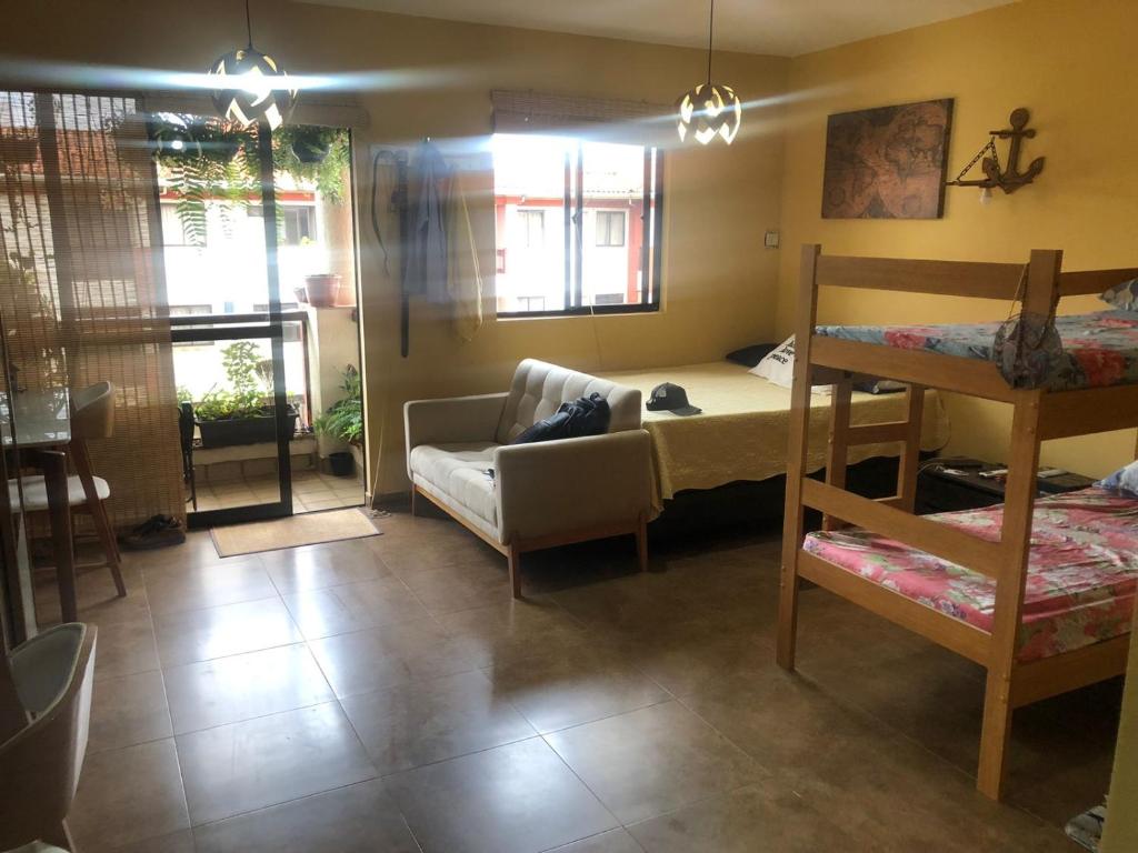 En eller flere senge i et værelse på Flat Lake Side Hotel SHOW DE FOGOS NA ORLA DO LAGO REVEILLON