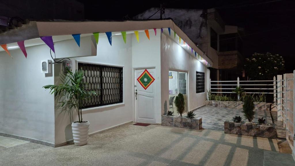 a house with a kite on the front of it at Hotel H&H in Cartagena de Indias