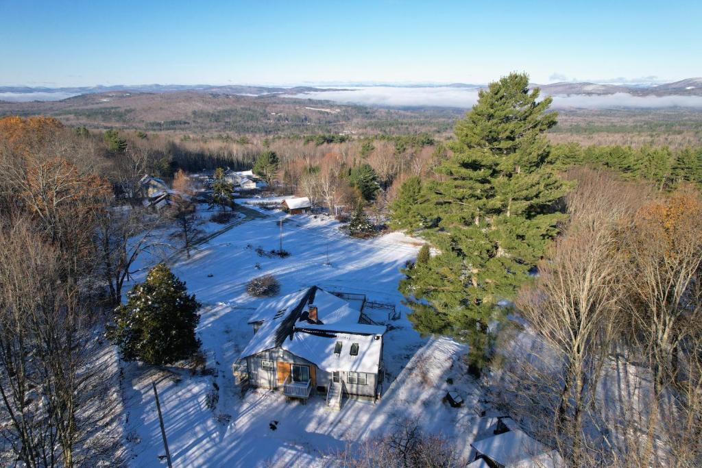 an aerial view of a house in the snow at 2T Bethlehem Retreat with Stunning Sunset Views in the Heart of the White Mountains in Bethlehem