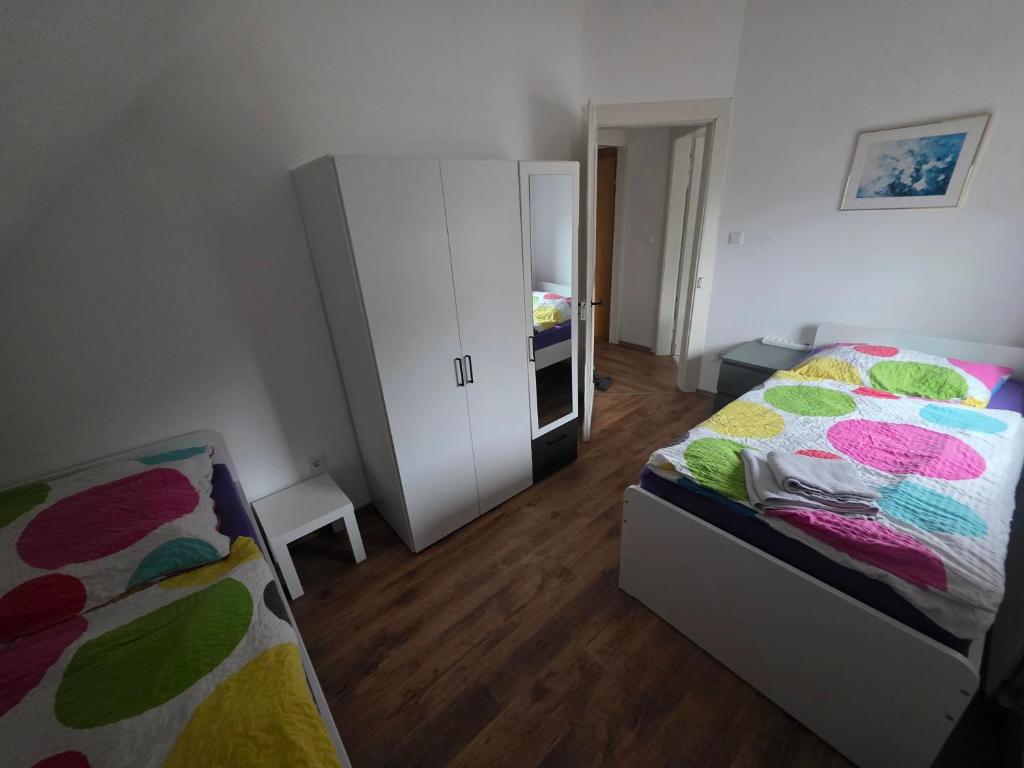 Ένα ή περισσότερα κρεβάτια σε δωμάτιο στο Nika