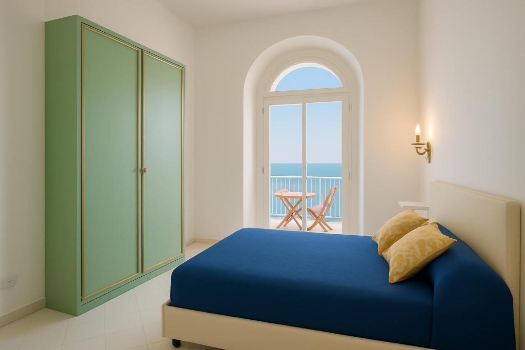 Ένα ή περισσότερα κρεβάτια σε δωμάτιο στο Villacore Capri