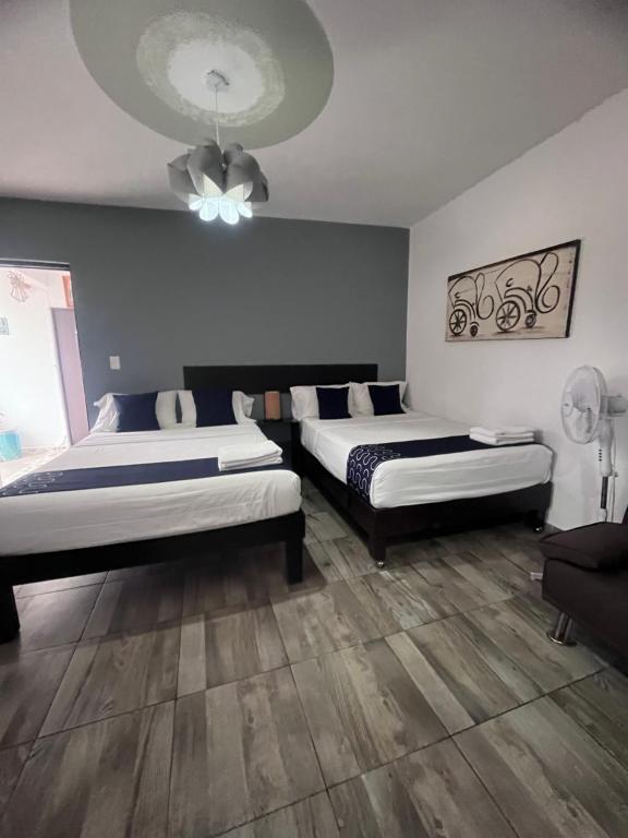 Postel nebo postele na pokoji v ubytování Hotel Gandag