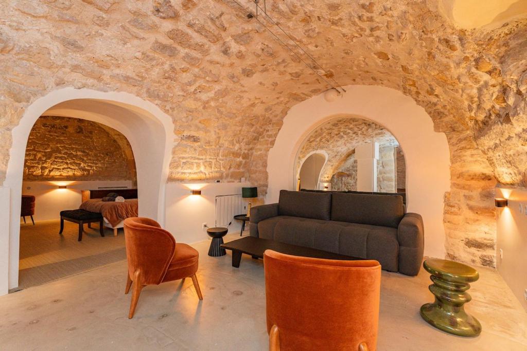 a living room with a couch and chairs at Exceptional Apartment Île Saint Louis - Jacuzzi in Paris