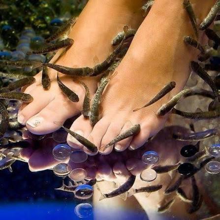 a person with their foot in the water with beads at NG Trips in Hurghada