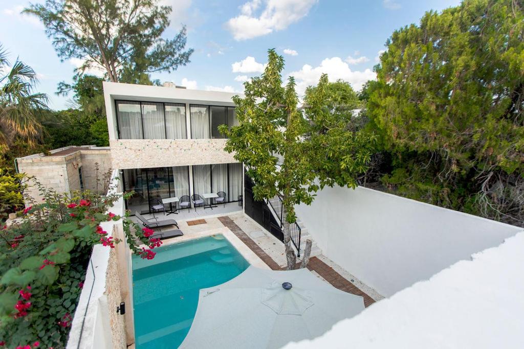 an aerial view of a house with a swimming pool at Casa Itzae Hotel Boutique in Mérida