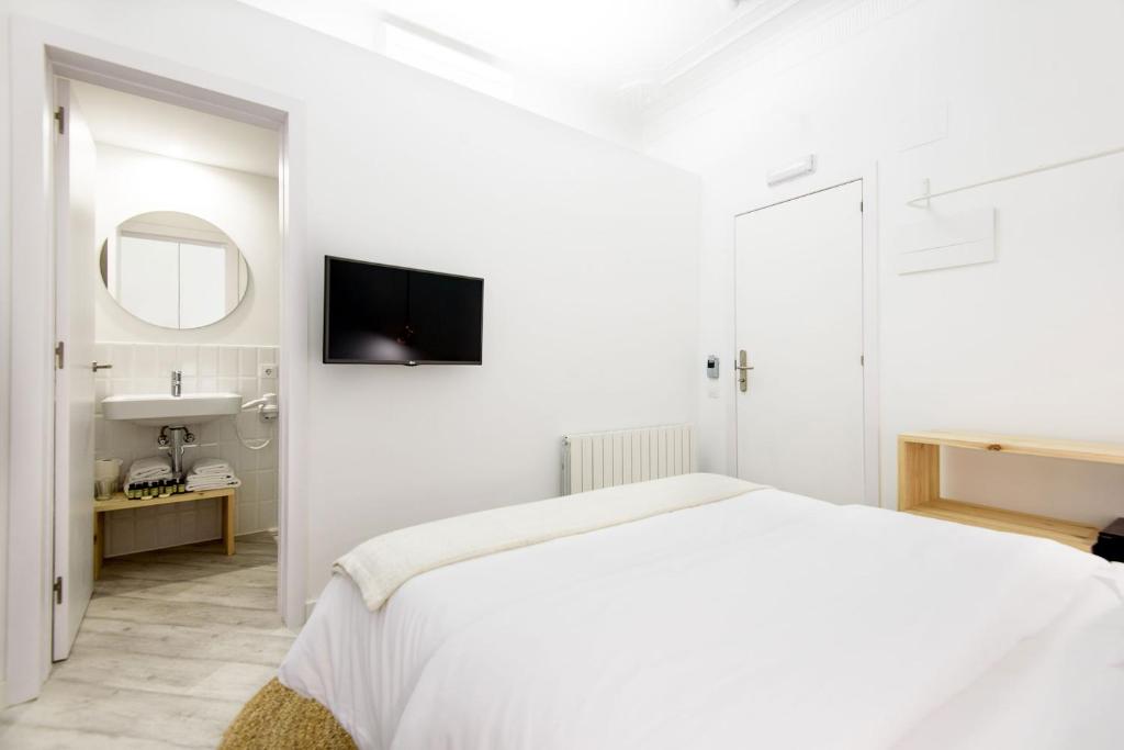 A bed or beds in a room at Bruc & Bruc