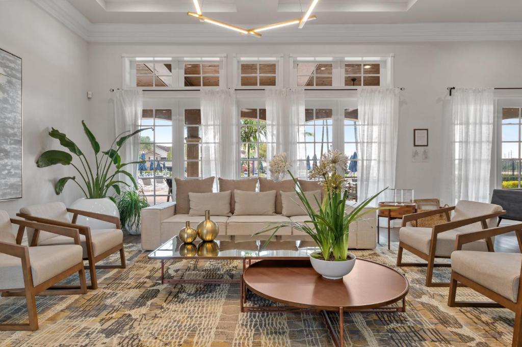 a living room with a couch and a table at Kasa Wellington South Florida in Wellington
