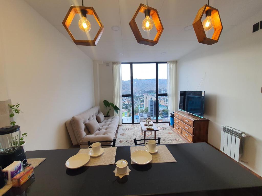 Телевизор и/или развлекательный центр в Hermoso, cálido y con vista espectacular departamento