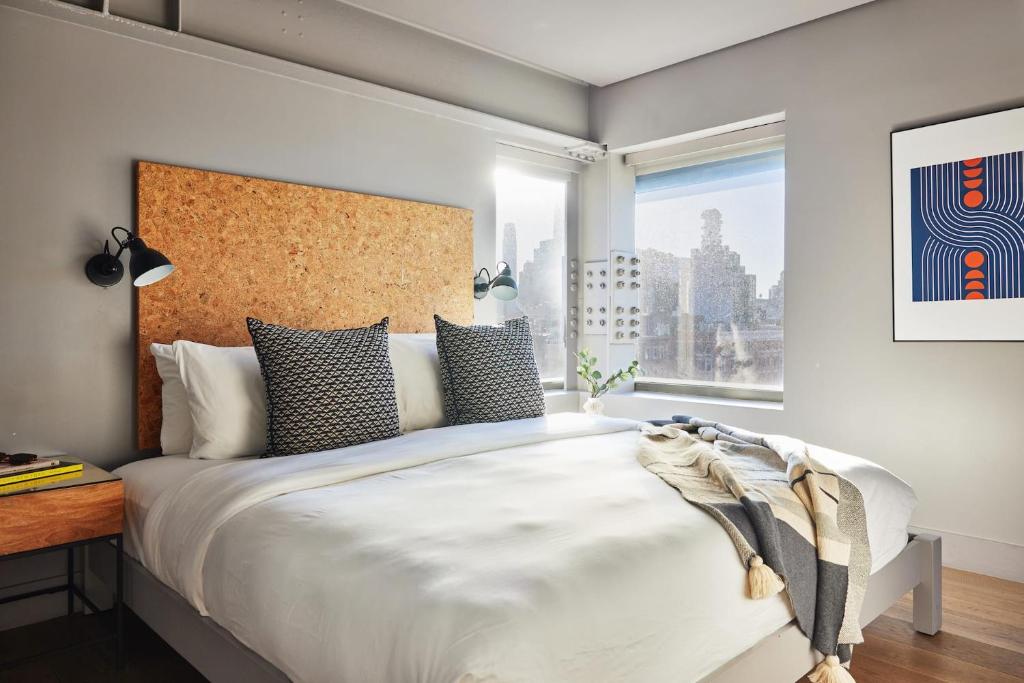 Ένα ή περισσότερα κρεβάτια σε δωμάτιο στο Kasa Lantern Lower East Side