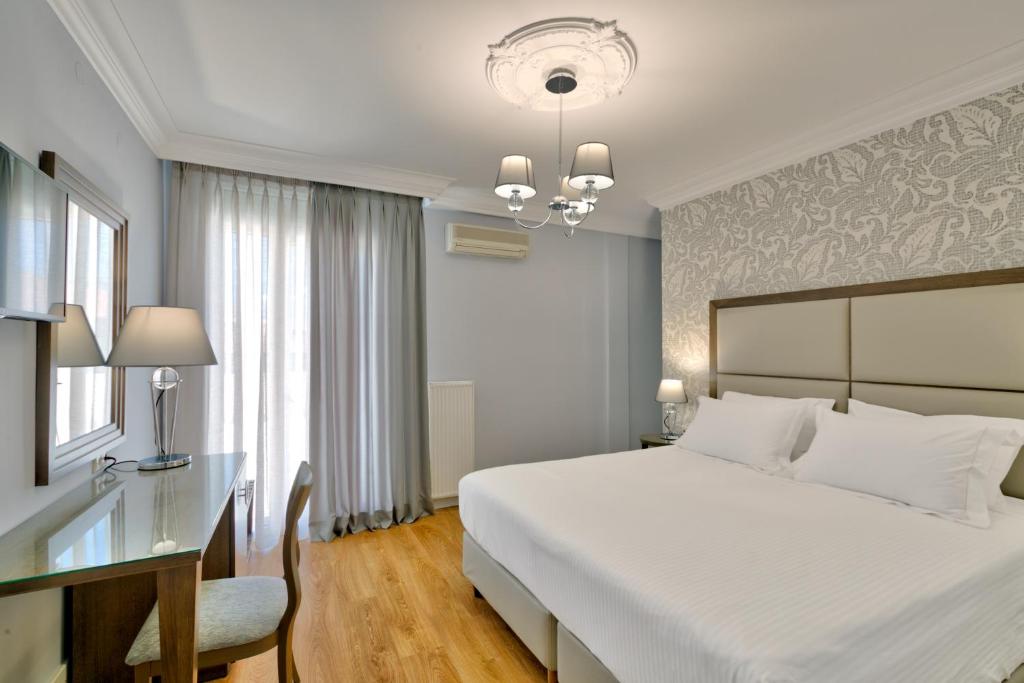 Postel nebo postele na pokoji v ubytování Anaktorikon Boutique Hotel