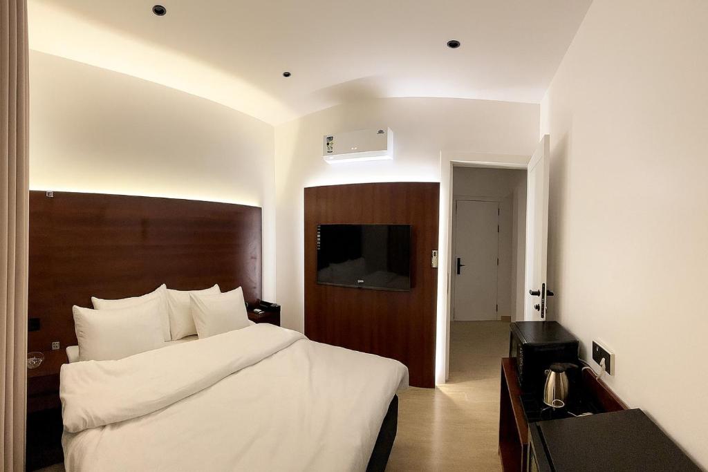 Ένα ή περισσότερα κρεβάτια σε δωμάτιο στο تيوليب للشقق الفندقية - Self entry