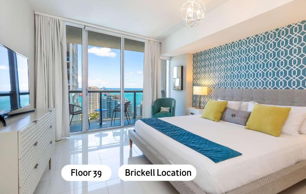 a bedroom with a large bed and a balcony at MVR - Luxury Vibes Above the City in Miami