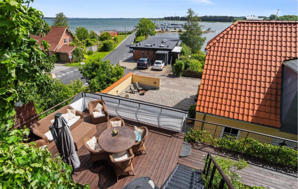 an overhead view of a deck with a table and chairs at Amazing Home In Hurup Thy in Doverodde
