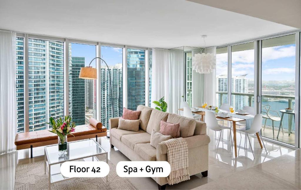 a living room with a couch and a table at MVR - Designer Condo in Prime Brickell in Miami