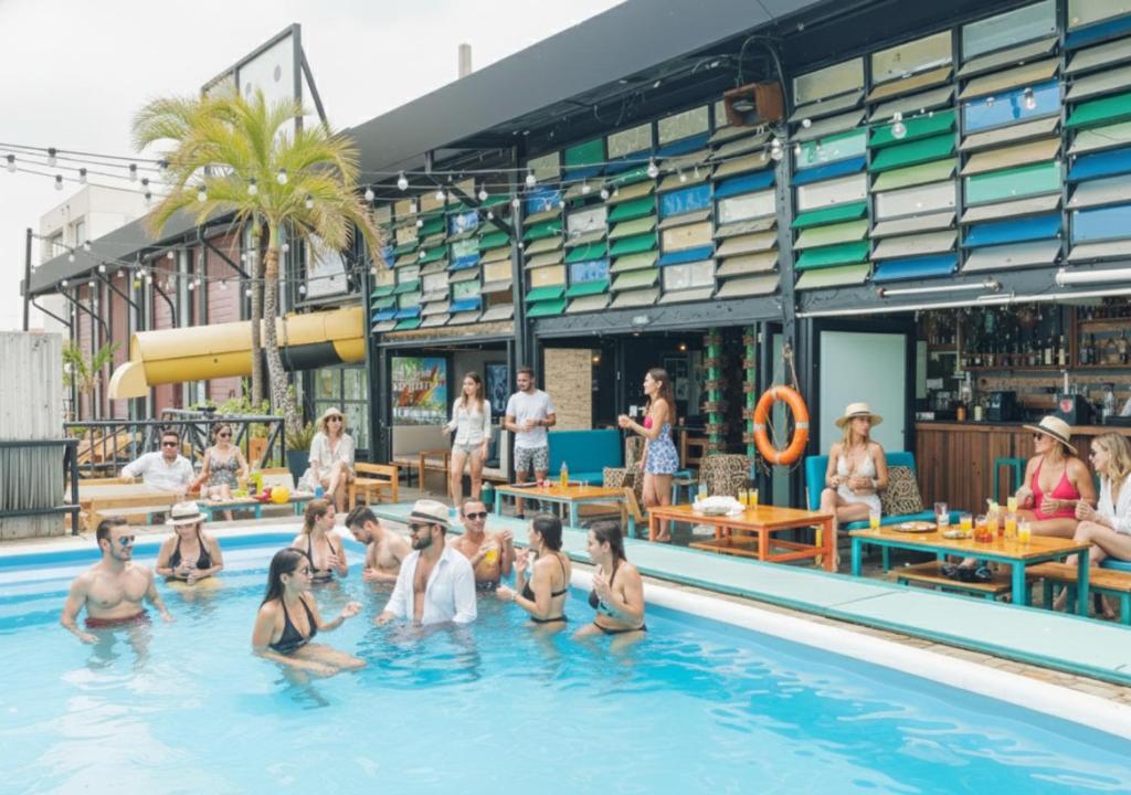 a group of people in a swimming pool at Mayan Monkey Cancun - Social Hotel in Cancún