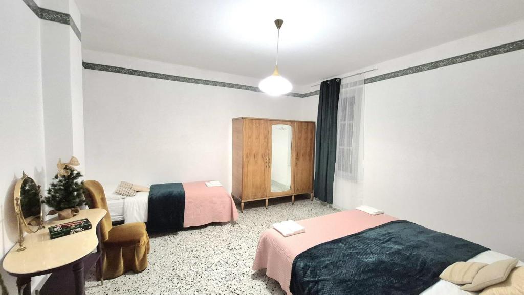 Ένα ή περισσότερα κρεβάτια σε δωμάτιο στο Villa Due Cieli 2