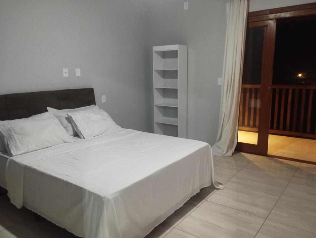 En eller flere senge i et værelse på Casa Blue