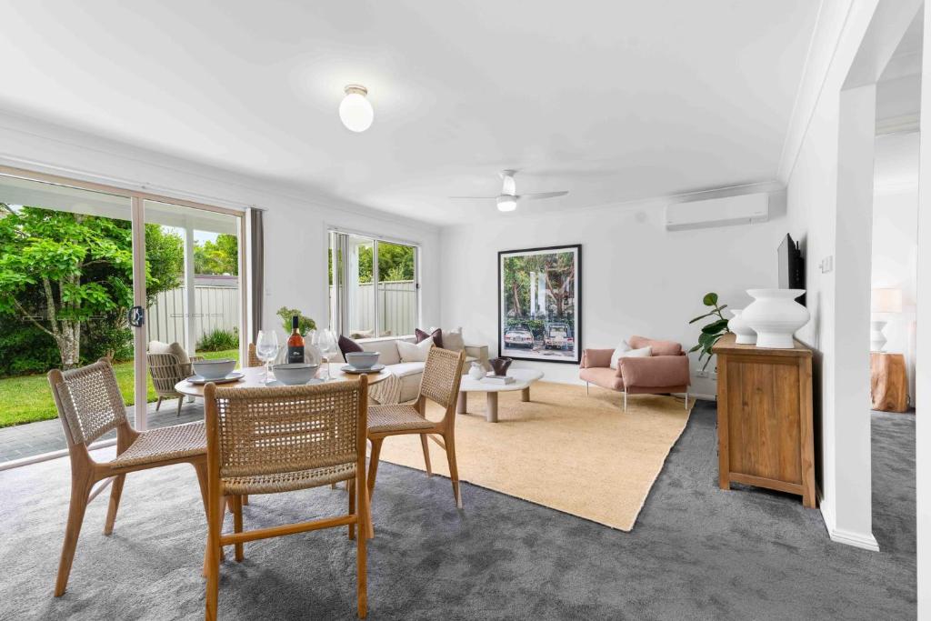 a living room with a table and chairs at The Little Husky by Experience Jervis Bay in Huskisson