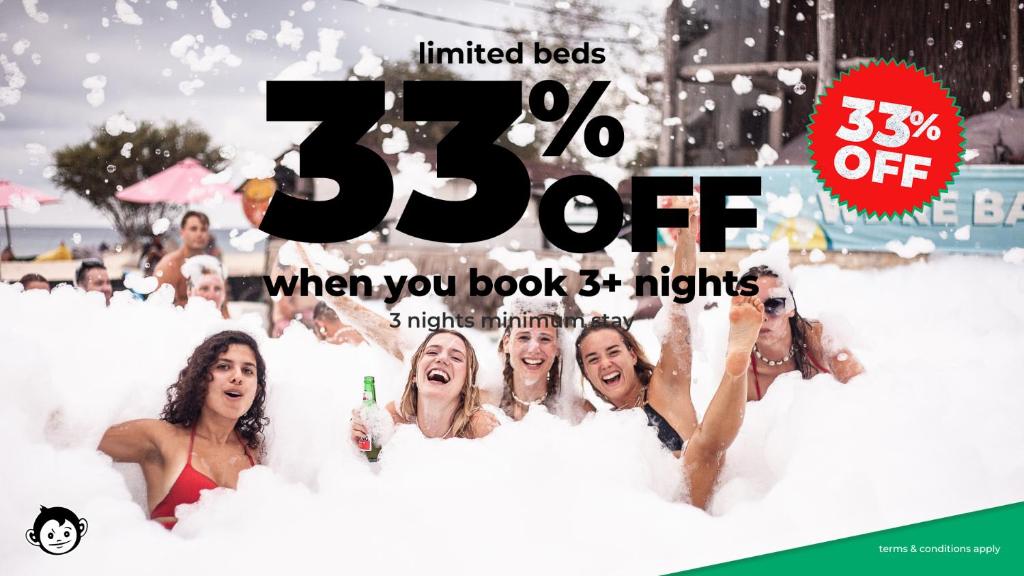 a poster for aussie holiday party in the snow at Mad Monkey Gili Trawangan in Gili Trawangan