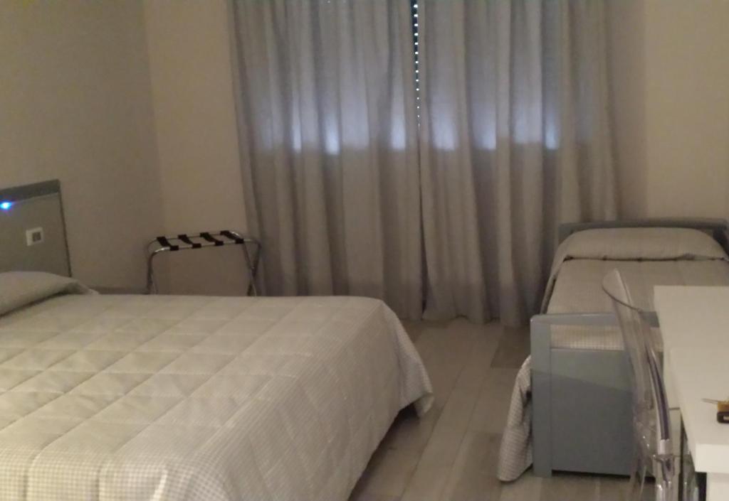 Postel nebo postele na pokoji v ubytování Hotel Villa Giulia