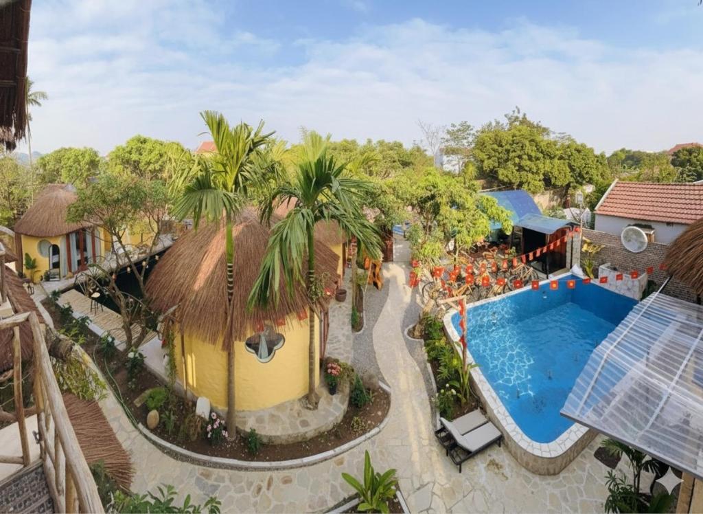 an aerial view of a resort with a swimming pool at Tam Coc Sora - Traditional Home - Center in Vũ Lâm