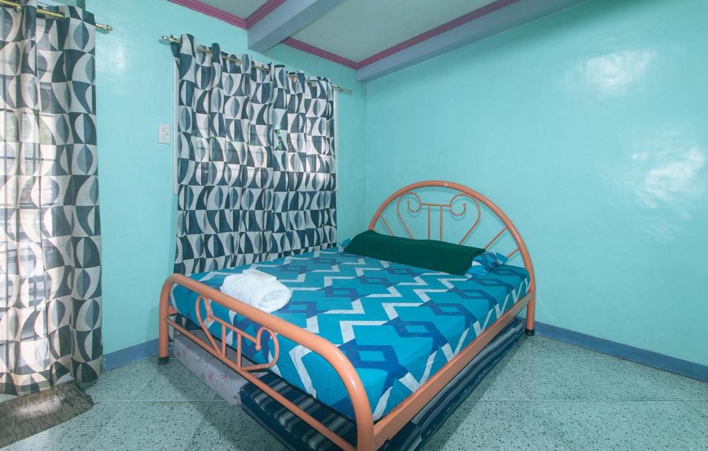 Postel nebo postele na pokoji v ubytování RedDoorz Hostel at MRC Residences Baguio