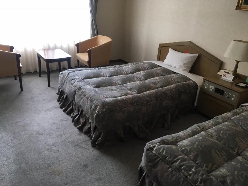 Postel nebo postele na pokoji v ubytování Breezbay Hotel & Resort Gero