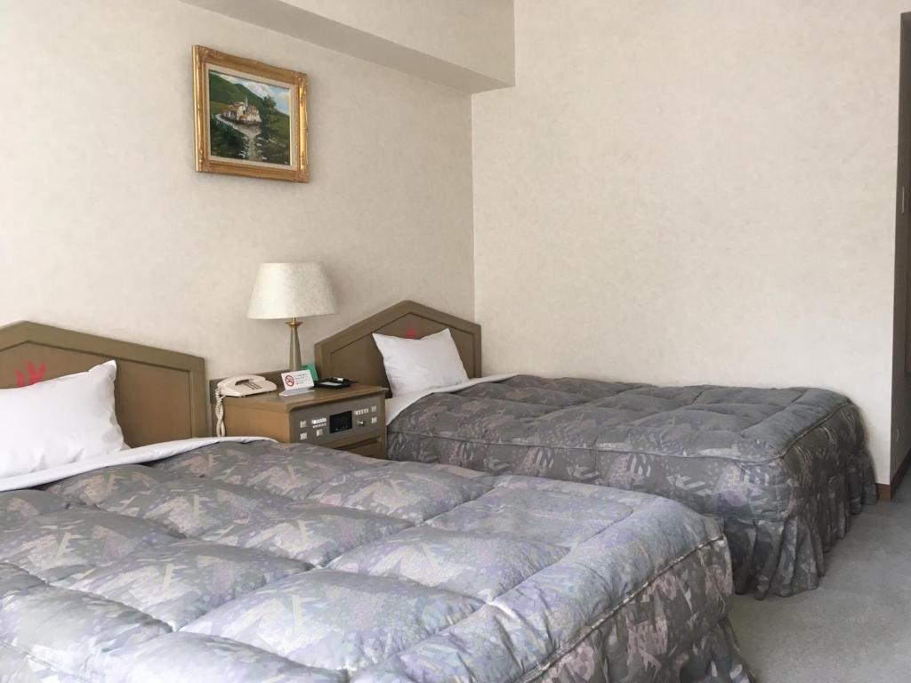 Postel nebo postele na pokoji v ubytování Breezbay Hotel & Resort Gero