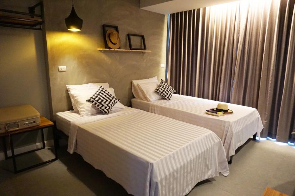 Postel nebo postele na pokoji v ubytování Hansa Bangkok House
