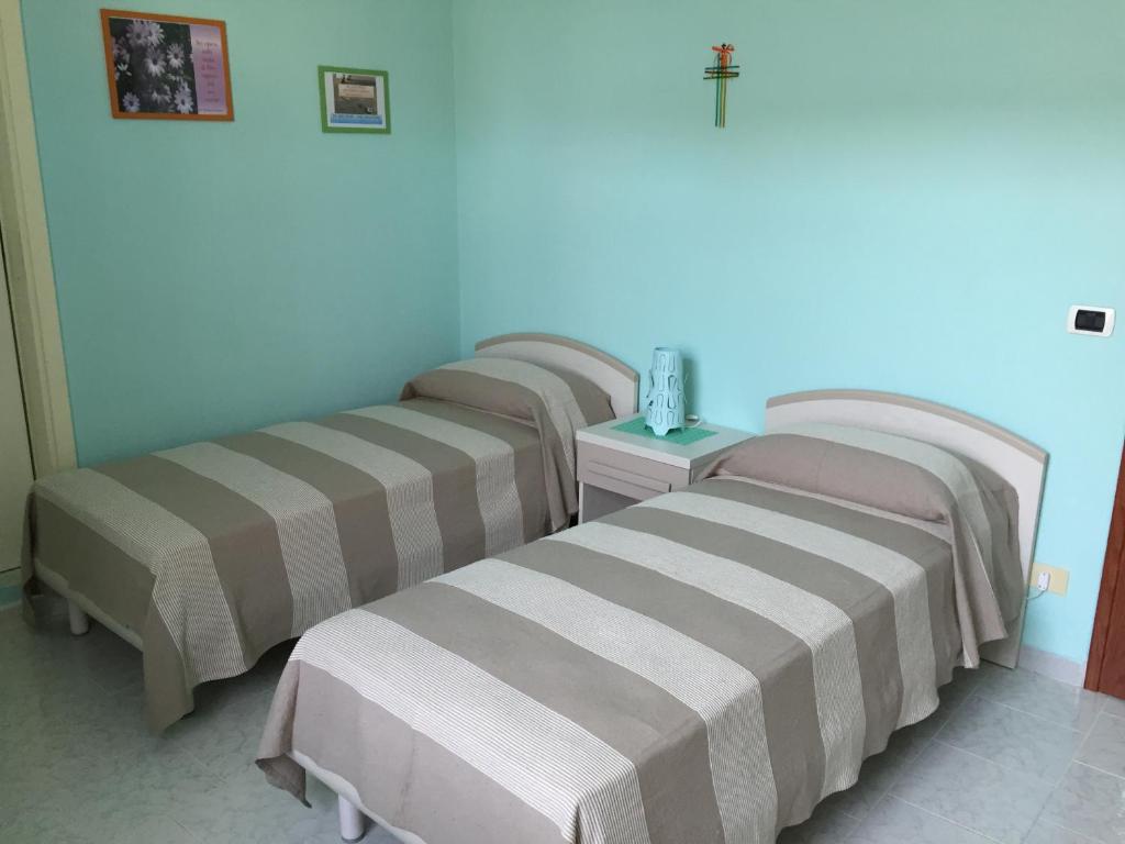 Posteľ alebo postele v izbe v ubytovaní Villa Preziosa
